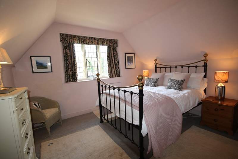 This is the double bedroom on the first floor. There is a feature Victorian fireplace.