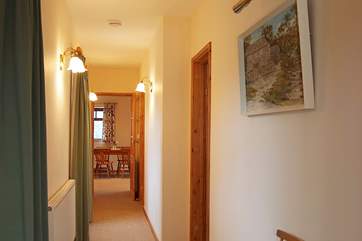 The light-filled hallway leading past the bedrooms towards the kitchen and the sitting-room.