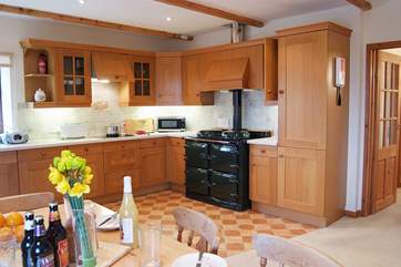 The large, light and spacious kitchen/dining-room in the heart of the home.