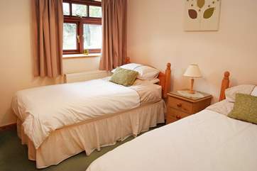 The pretty twin bedroom (Bedroom 2) is next door to the bathroom.