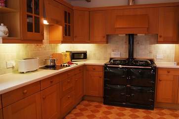 The large kitchen is well-equipped and includes an oil-fired Alpha range cooker for those home cooked meals.