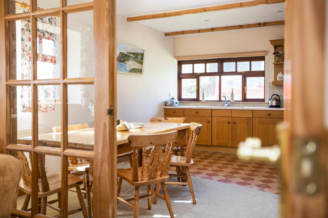 Double doors link the kitchen/diner to the sitting-room.