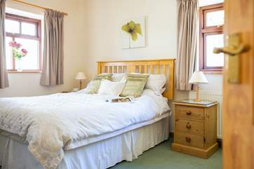 The master bedroom has a king-size bed to stretch out in.