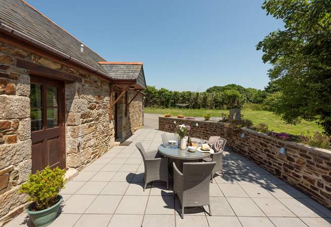 The patio overlooks your large lawn area.