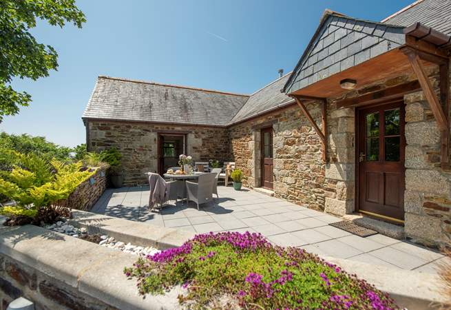 The sheltered patio has a sunny disposition.