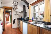 The galley kitchen is the perfect place to create a culinary masterpiece.