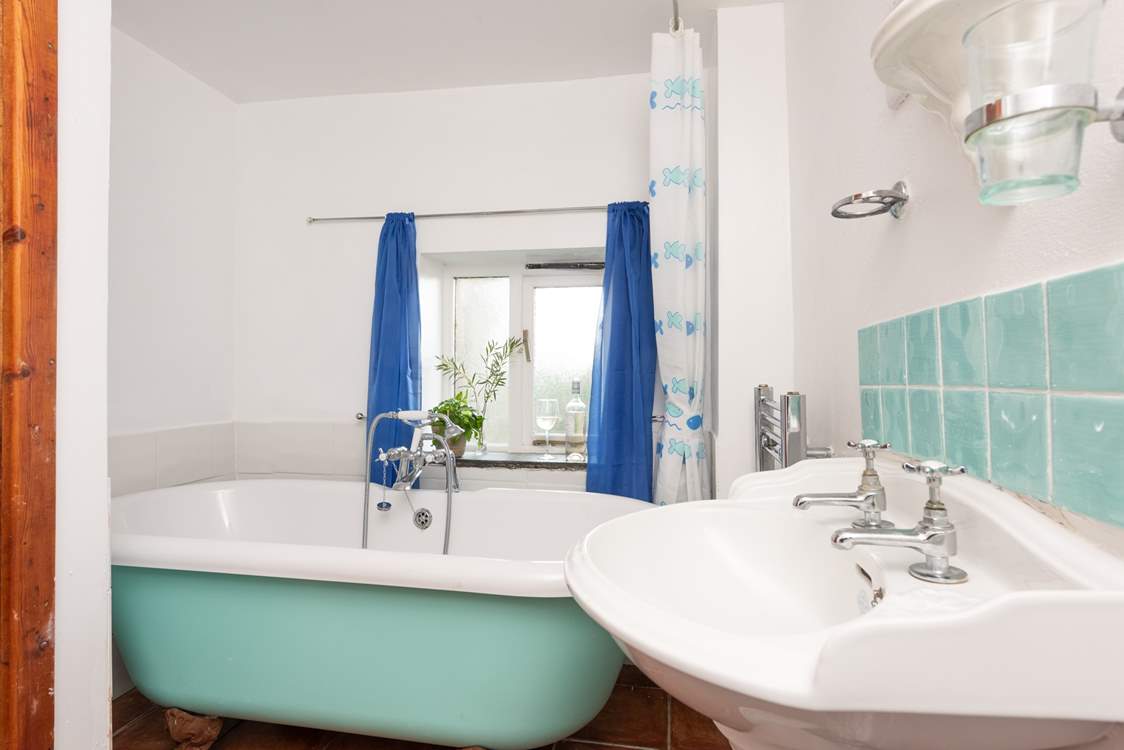 The bathroom has a lovely roll top bath for a relaxing soak after a busy day.