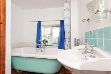 The bathroom has a lovely roll top bath for a relaxing soak after a busy day.