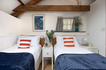 Bedroom two is a pretty twin.