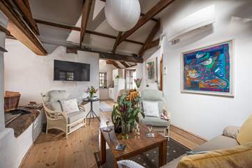 The sitting area has a sofa and two arm chairs.