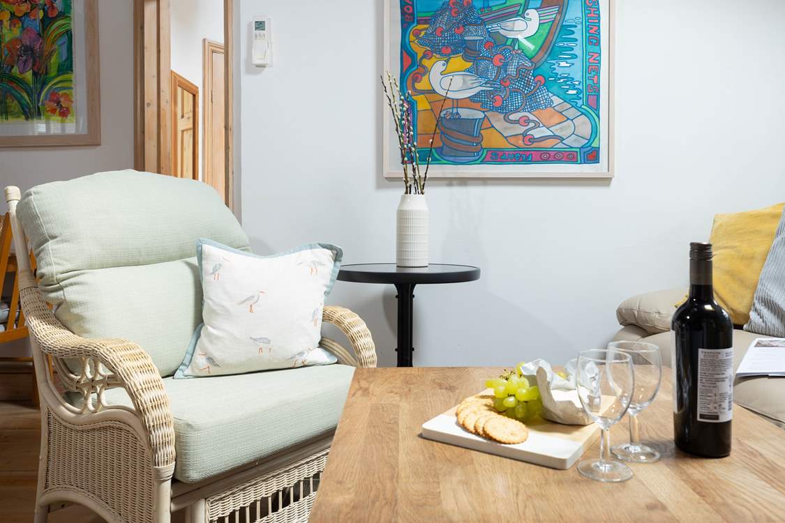 The sitting area has a sofa and two arm chairs.