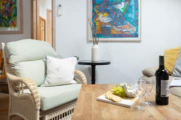 The sitting area has a sofa and two arm chairs.