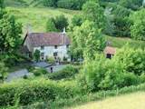 The cottage nestles to the left-hand side of the farmhouse. This is a wonderful Exmoor setting, where dogs are welcome and walks are wonderful. The garden is just to the left of the cottage.