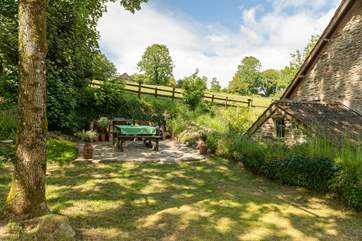 This is the enclosed side garden with picnic table and fitted barbecue.