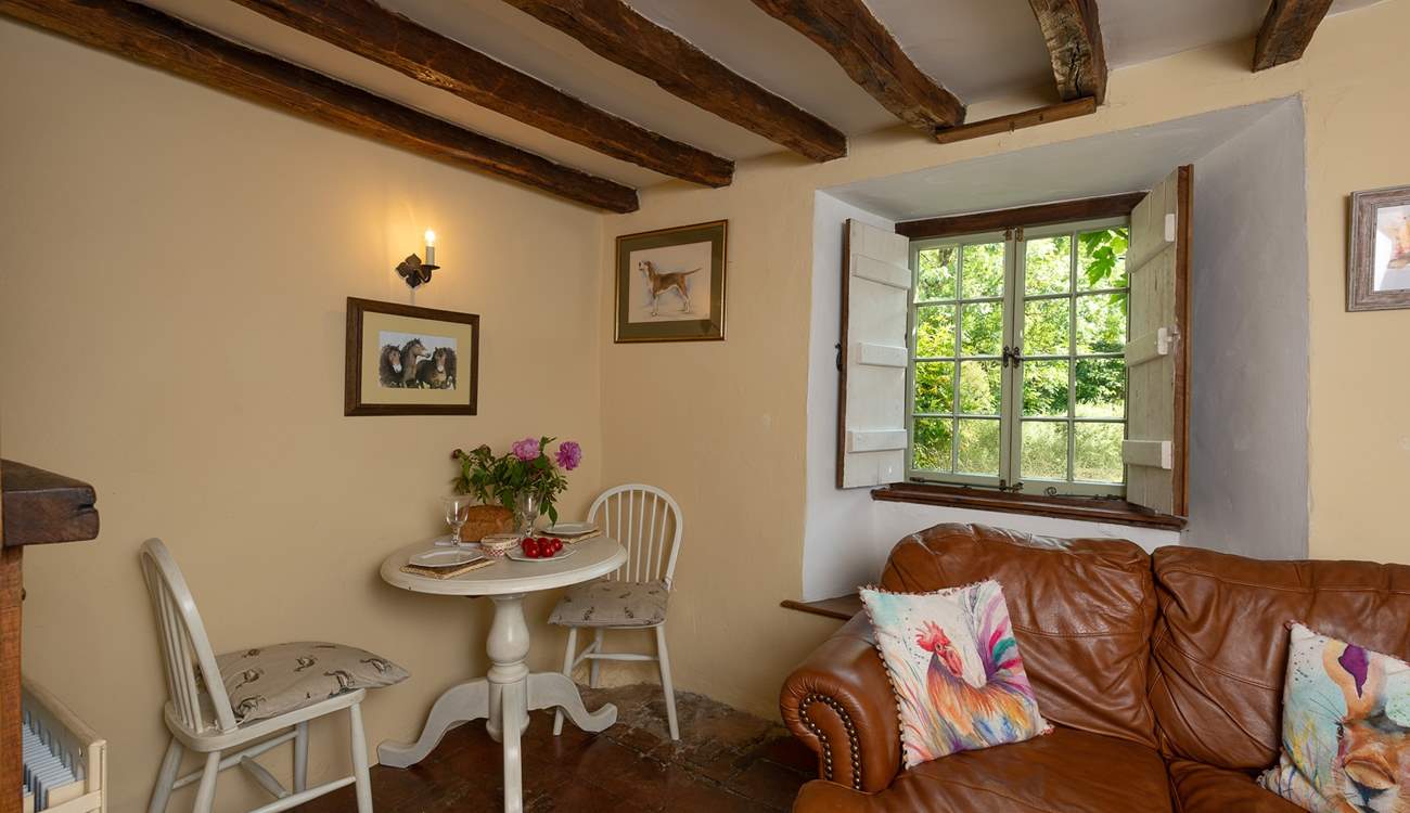 The dining-table is tucked in one corner of the room.