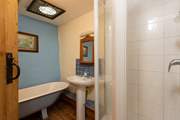 The bathroom, also on the first floor, offers an original roll-top bath as well as a shower cubicle.