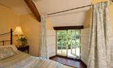 Low window sills and wooden shutters celebrate this wonderful stone cottage. - Thumbnail Image