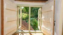 A little window on the landing looks out over the garden.