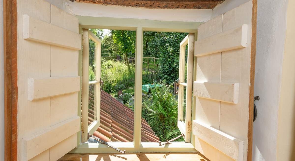 A little window on the landing looks out over your garden.