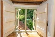 A little window on the landing looks out over the garden.