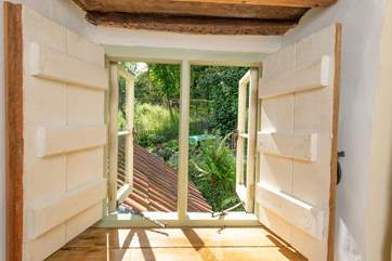 A little window on the landing looks out over your garden.
