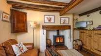 The open plan ground floor has a wood-burning stove and so much character.