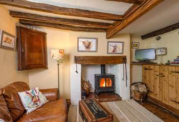 The open plan ground floor has a wood-burning stove and so much character.