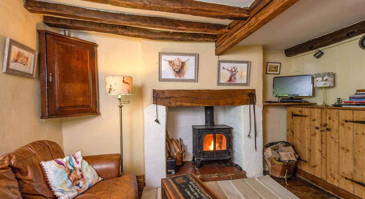 The open plan ground floor has a wood-burning stove and so much character.