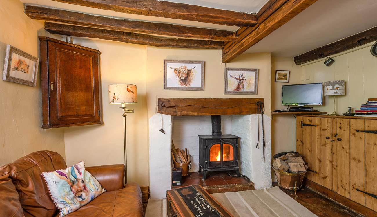 The open plan ground floor has a wood-burning stove and so much character.