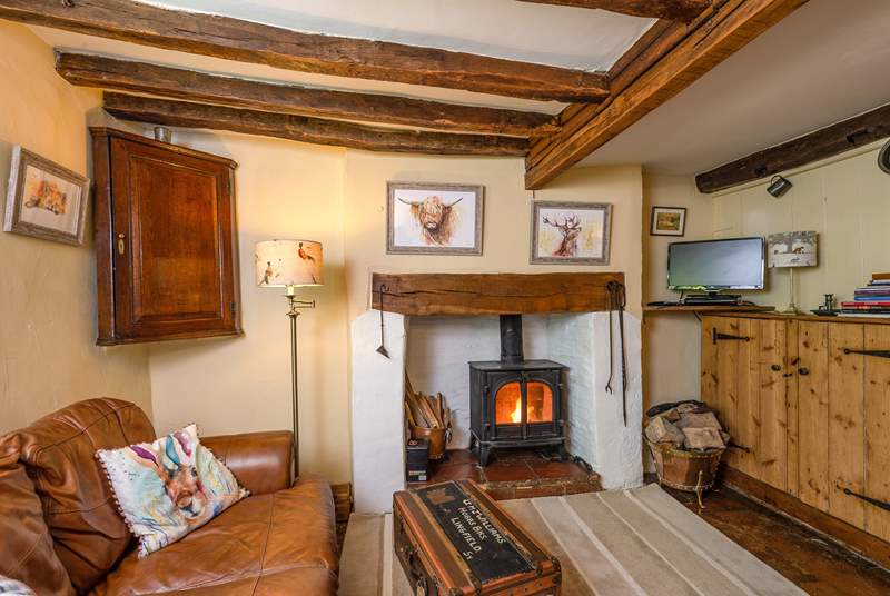 The open plan ground floor has a wood-burning stove and so much character.