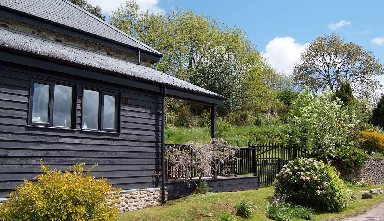 Parking is just beyond the cottage on the right.