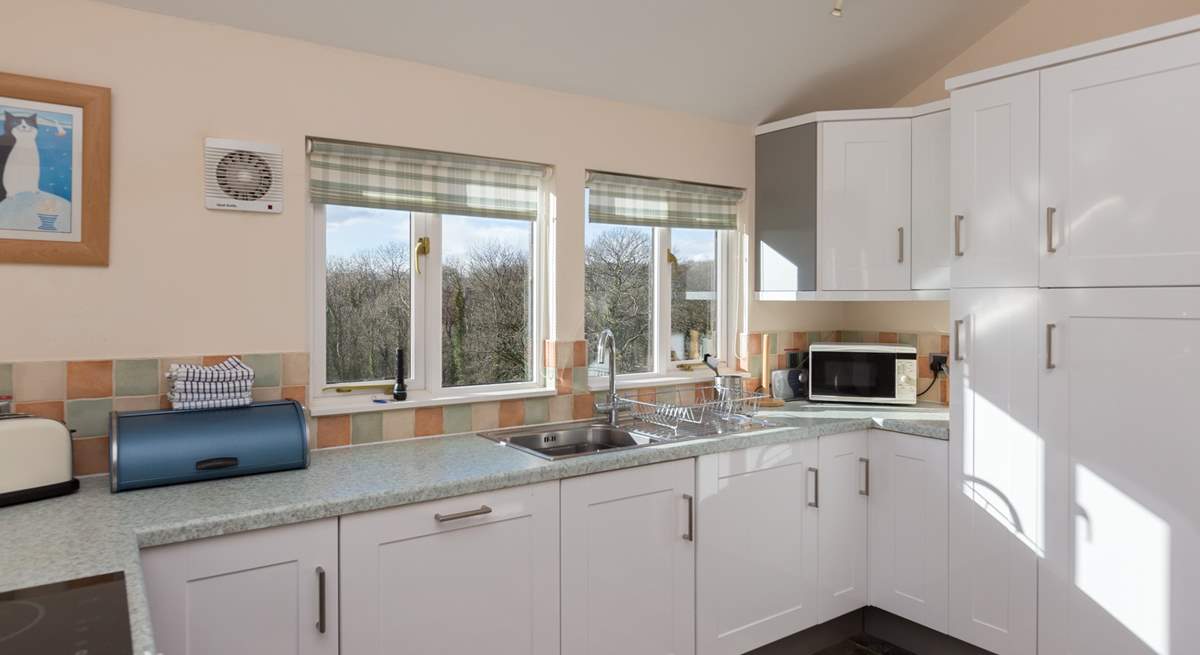 The dual-aspect kitchen makes the most of the amazing views from the cottage - all the way to Dartmoor!