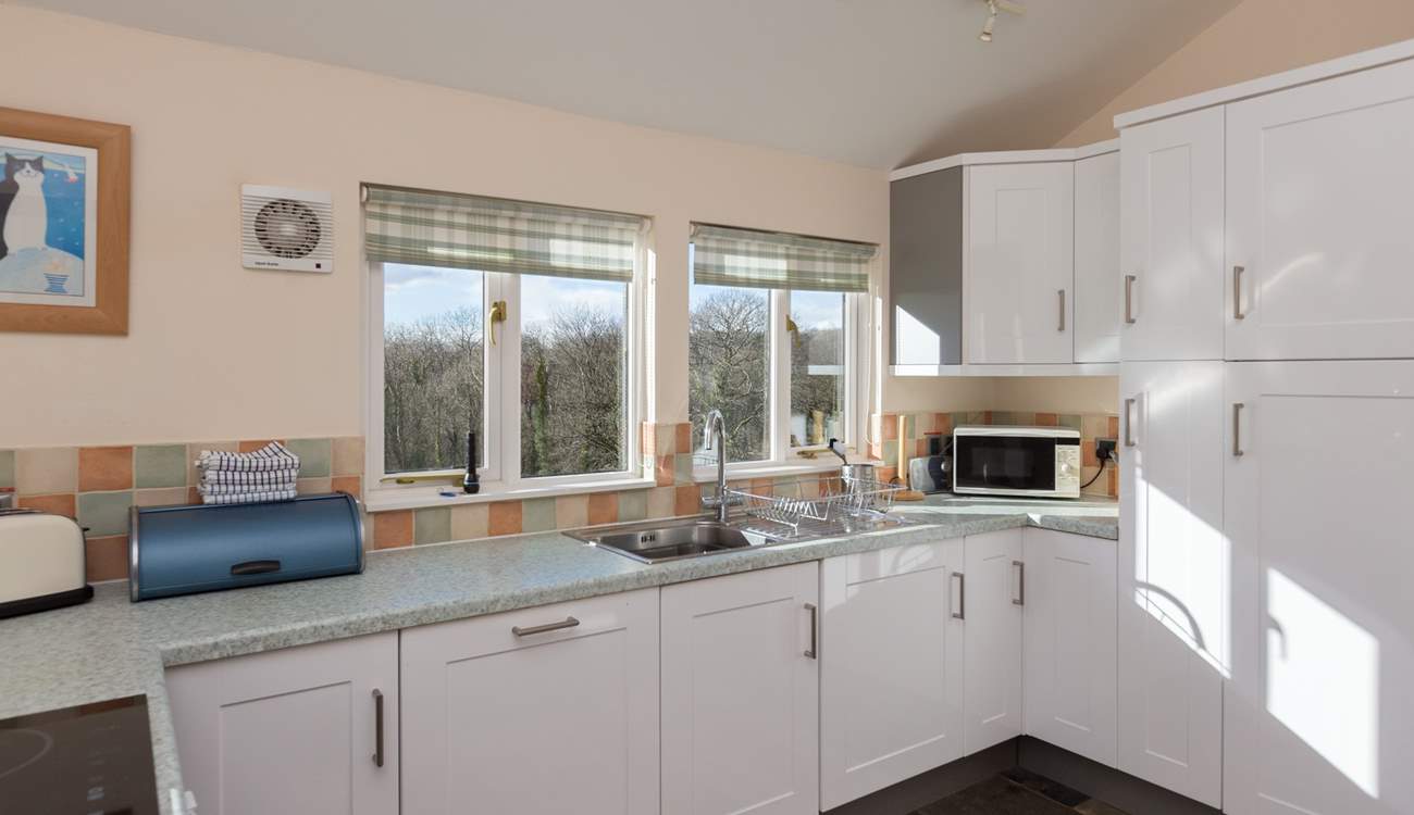 The dual-aspect kitchen makes the most of the amazing views from the cottage - all the way to Dartmoor!