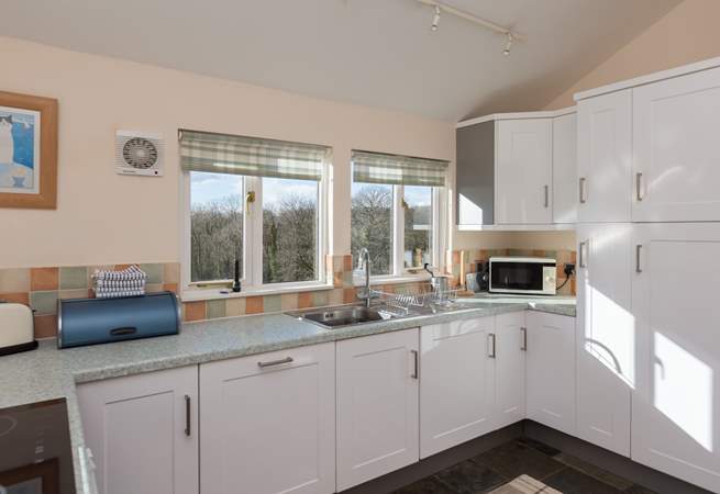 The dual-aspect kitchen makes the most of the amazing views from the cottage - all the way to Dartmoor!