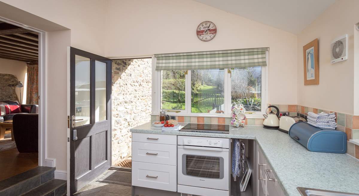 Looking across the kitchen to the garden and terrace.