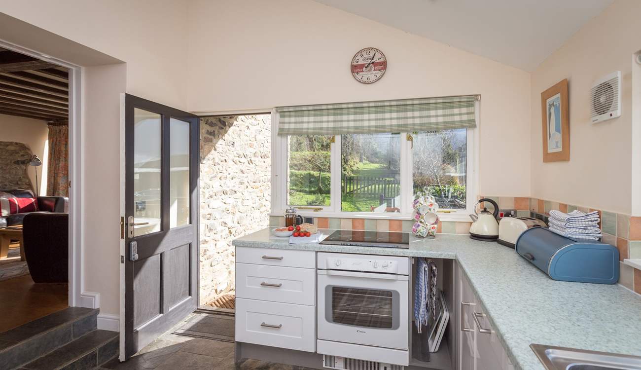 Looking across the kitchen to the garden and terrace.