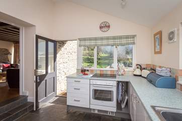 Looking across the kitchen to the garden and terrace.