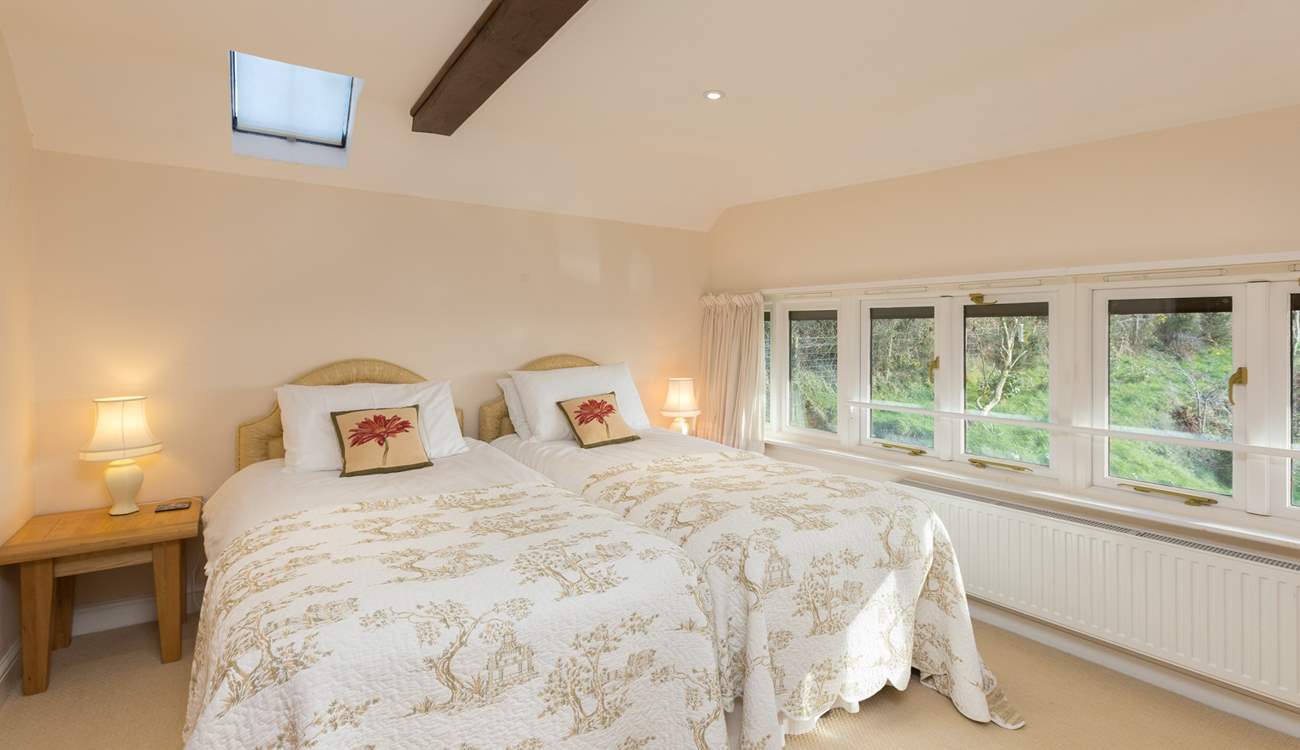 This is the second bedroom - also with a fabulous view towards the farmstead and the valley beyond it.