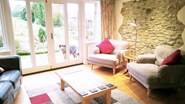 Another view of the living room - you can have the French windows wide open on a sunny day and enjoy watching all the bird life in the garden.