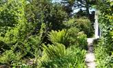 The path leads through the garden to the front door. - Thumbnail Image