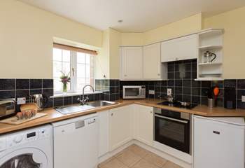 The kitchen is fitted around three sides of this room and so is a very practical and open space.