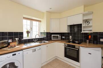 The kitchen is fitted around three sides of this room and so is a very practical and open space.