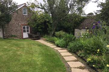 Fig Tree Cottage is in its own private walled garden, a magical place to rewind after a day of exploring.