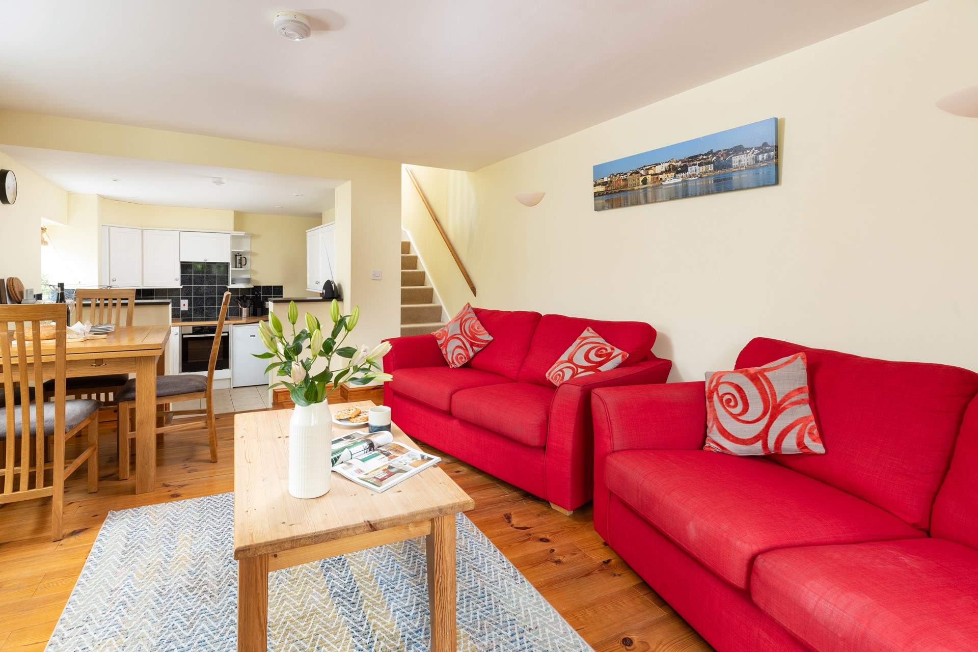 The ground floor is a cheerful open plan layout, with steps down to the kitchen-area.