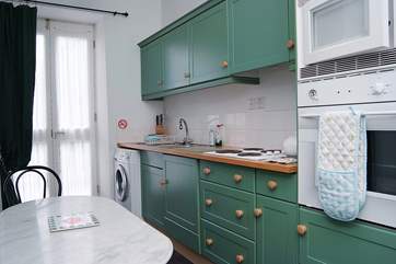 The fitted kitchen-area leads out onto the patio.