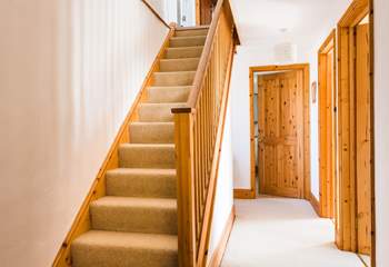 The stairs up to the first floor living-space and Bedroom 1.