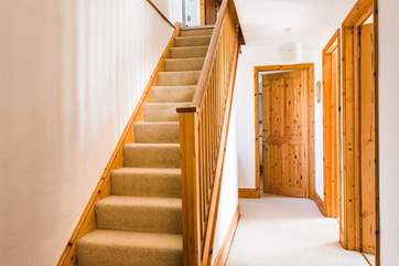 The stairs up to the first floor living-space and Bedroom 1.