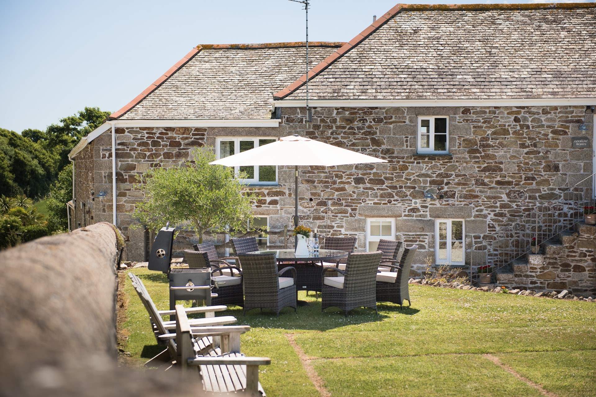 Enjoy a relaxing meal in the large garden at Wallis Barn.