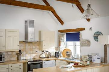 The well equipped kitchen is open plan with the dining and living space and has all you'll need.