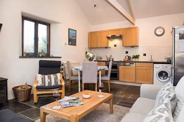 The kitchen is well-equipped and you can take your meals at the dining-table or outside on the terrace.